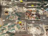 many different stamps on a table with plastic wrap