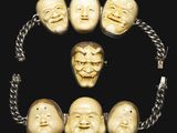 a close up of a bracelet with a bunch of faces on it