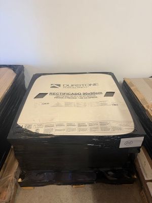 several boxes of wood are stacked on top of each other in a room