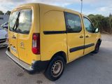the yellow van is parked in the parking lot next to other cars