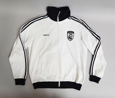 a white jacket with black stripes and a black hoodie on a hanger