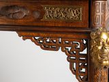 a close up of a wooden table with a clock on it
