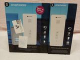 two nintendo wii remotes in the box on the table