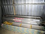 a stack of metal beams in a storage room