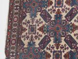 an image of a large oriental rug on a white surface