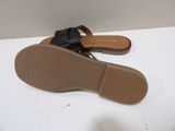 the shoe is black and has a bow on the toe