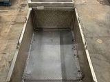 a metal box that is sitting on the floor