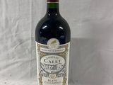a bottle of wine that is sitting on a table