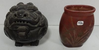 two vases sitting next to each other on a table