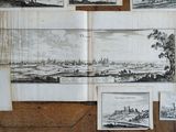 some old black and white drawings on a wooden surface