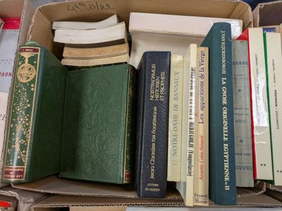 a box full of books sitting on top of a table