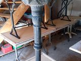 a statue of a dragon on a pedestal in a room