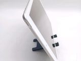 a white tablet computer sitting on top of a table