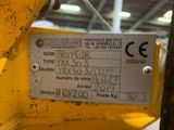a label on the back of a machine that is in a warehouse