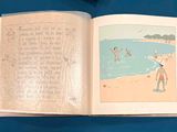 an open book with a picture of a man on the beach