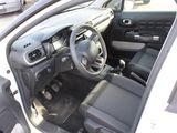 a picture of a car with the door open and the driver ' s seat down