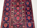an antique persian rug with a blue and red design