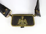 a black belt with a gold eagle on it