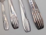 four spoons and two spoon spoons on a table