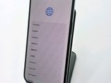 the back of a phone with a display on it sitting on top of a table