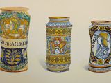 three vases that are painted in different colors