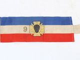 une ceinture sur laquelle est représenté un blason
