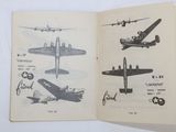 a book with pictures of airplanes on it on a table