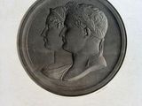 une gravure représentant le portrait d'un homme et d'une femme de profil