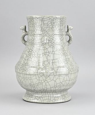 a white vase that has a cracky design on it