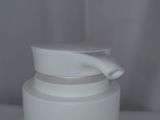a close up of a bottle of liquid sitting on a table