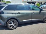 the rear end of a gray suv parked in a parking lot