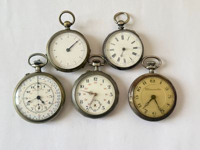 several different types of pocket watches are displayed on a white surface