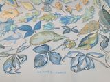 a picture of a table cloth with a bunch of leaves on it