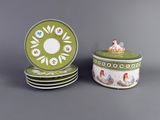 three green and white plates and a green and white container