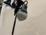 a lamp that is on a pole in a room