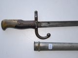 pair of old and worn swords on a white surface