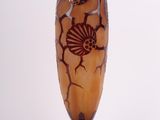 a vase that has a design on it on a stand