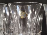a close up of a glass vase with a yellow sticker on it