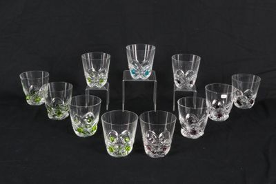 a group of glasses sitting on top of a table next to each other