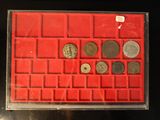 a picture of a display case with coins in it