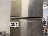 several stainless steel refrigerators stacked on top of each other in a kitchen