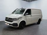 the white van is parked in a large room