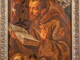 an old painting of a man reading a book with a skull in the background