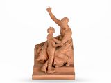une photo représentant une statue d'un homme et d'une femme assis sur un banc