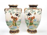 pair of asian vases with asian women on them on a white background