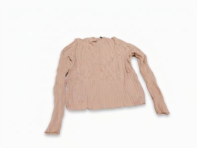 a close up of a sweater on a white background