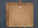 an old wooden easel with a blank canvas on it