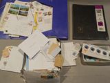a box of mail sitting on a table next to a book