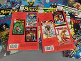 a lot of comic books sitting on a table