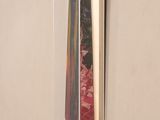 a picture of a tie hanging on a wall in a room